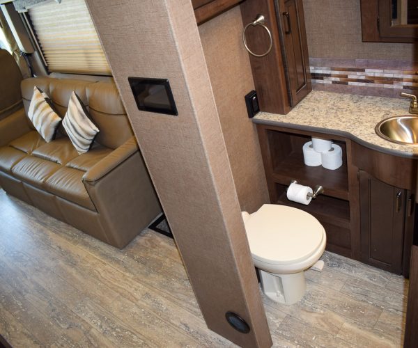 A bathroom with a toilet and sink in it