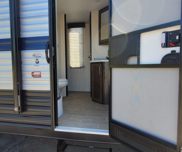 A door open to the outside of an rv.