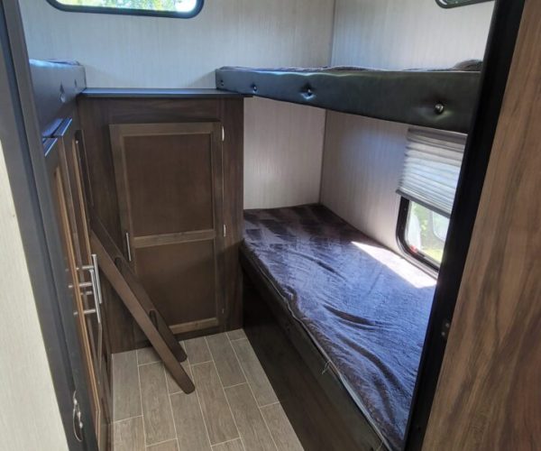 A view of the bunk beds in a trailer.