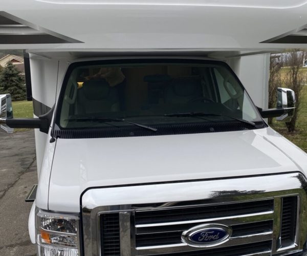 A white truck with the word " sayes " on it.